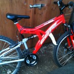 bike2 The CBR Redrock mountain bike - looks nice, but actually a death trap. Note the brake lever hanging down by the wheel.