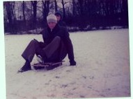 My dad on the sledge he built